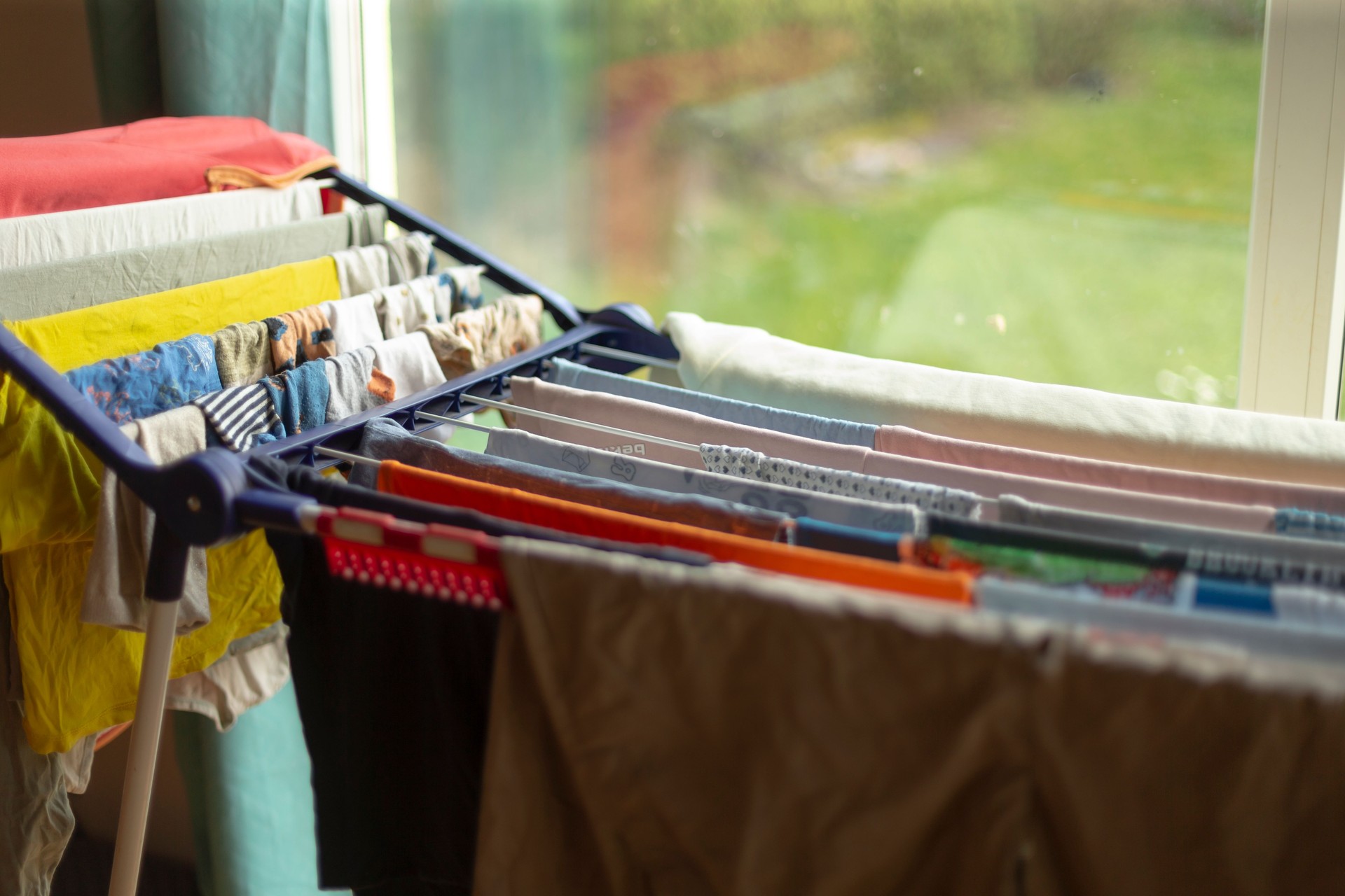 Indoor Clothes Drying Rack with Freshly Washed Laundry to Save Space